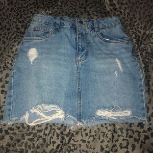 Distressed denim mini skirt